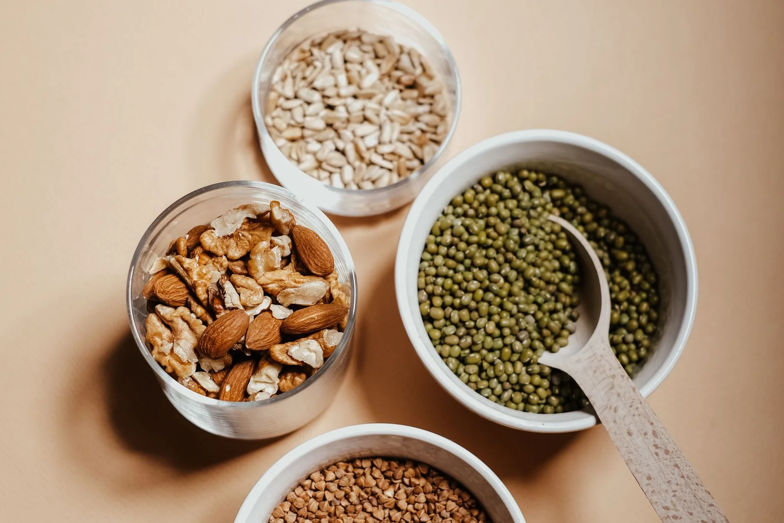 Everyday food sources including nuts, seeds, vegetables, and balanced ingredients